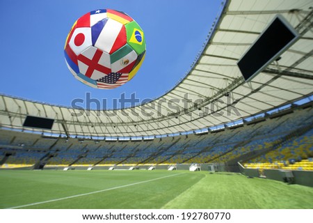 International team flag football soccer ball flying over bright green grass stadium pitch