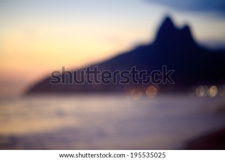 Defocus Rio de Janeiro Brazil sunset silhouette of Two Brothers Dois Irmaos Mountain and Ipanema Beach shore
