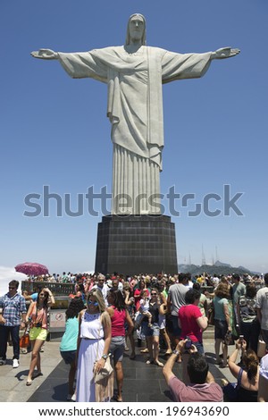 RIO DE JANEIRO, BRAZIL - OCTOBER 20, 2013: Tourists crowd the viewing platform at the statue of Christ the Redeemer, at the peak of Corcovado Mountain.