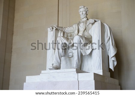 Statue of American president Abraham Lincoln seated in white marble at Lincoln Memorial Washington DC USA
