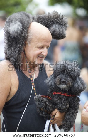 RIO DE JANEIRO, BRAZIL - FEBRUARY 16, 2014: The annual Blocao party attracts a variety of dogs and their owners to celebrate Carnival together in Copacabana.