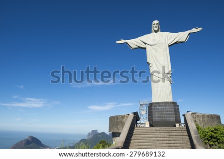 RIO DE JANEIRO, BRAZIL - MARCH 05, 2015: Statue of Christ the Redeemer stands above an empty viewing platform before the arrival of the first morning tram.