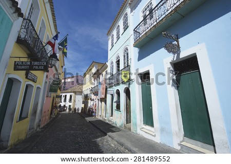 SALVADOR, BRAZIL - MARCH 12, 2015: Tourist Police office stands on cobblestone street lined by colorful colonial buildings in Pelourinho, the historic district.