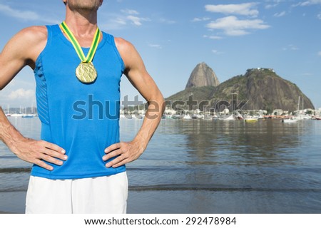 Frst place athlete wearing gold medal standing outdoors at Botafogo Bay Rio de Janeiro Brazil