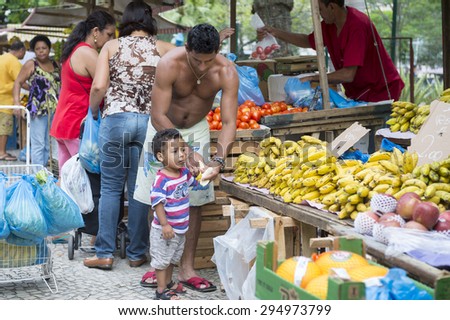 RIO DE JANEIRO, BRAZIL - FEBRUARY 27, 2015: Brazilians shop at the weekly fruit and vegetable market at General Osorio Plaza in Ipanema.