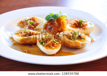 Thai fansy eggs dish called Kai-Look-Keoy topping with tamerind sauce