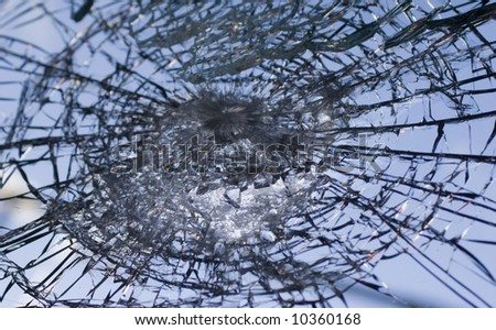 Window shattered by high velocity impact   - landscape orientation
