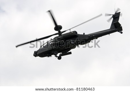 WADDINGTON, ENGLAND, UK - JULY 2: Apache Longbow attack helicopter at Waddington International Air Show on July 2, 2011 in Waddington, England, UK. Flown by WO2 Bruce Allen and Captain Scottie Hewitt.