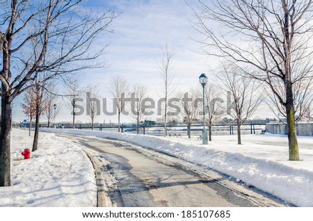 Curving Path in a Park Covered in Snows