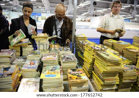 SERBIA, BELGRADE - OCTOBER 21, 2013: People choosing a book at the International Belgrade Book Fair, one of the oldest and most important literary events in the region