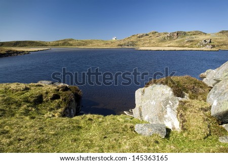 Loch Ceann Hulabhaig, Callanish, Isle of Lewis, Scotland, UK Overlooking the loch towards one small house.