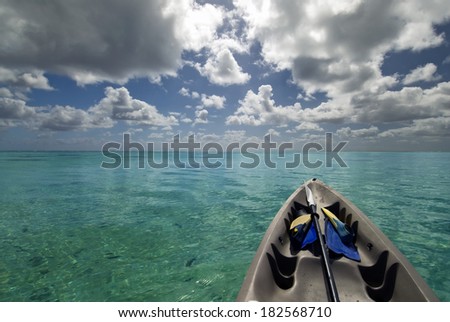 Kayak with snorkeling gear on tropical lagoon.