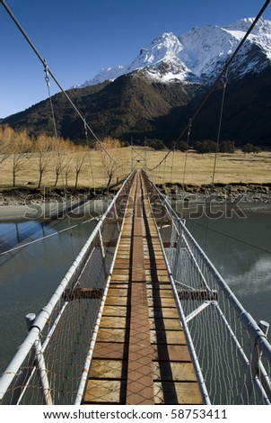 Swing Bridge crossing the Matukituki River. Mount Aspiring National Park. South Island, New Zealand.