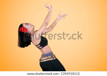 Similar – Image, Stock Photo Graceful Arab woman doing Anjaneyasana pose on pier
