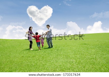 Happy family enjoying valentine in the park