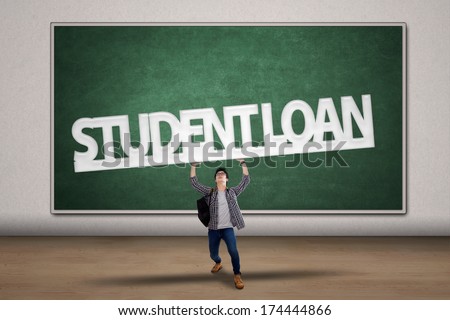 Young male college student holding a sign of student loan