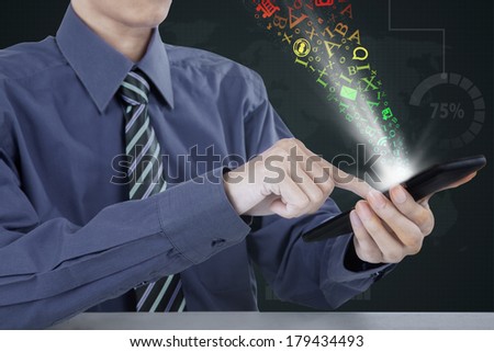 Close up of a businessman using a mobile phone with flying letter out of it