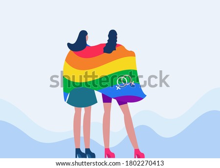 Lesbian couple vector concept: lesbian women covering each other with a rainbow gay pride flag
