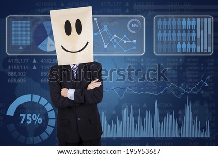 Businessman with cardboard head and business statistics on futuristic interface