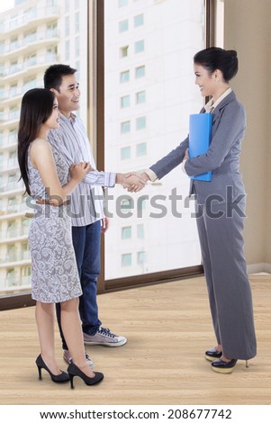 Portrait of asian people in home selling transaction