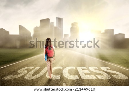 Female college student walk on the road to start her success