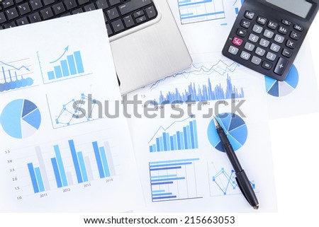 High angle view of finance chart with laptop computer, calculator, and pen
