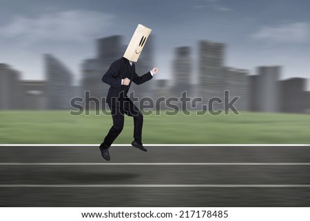 Businessman with mask running to compete on track. Shoot outdoors