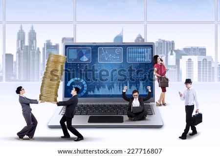 Business chart on laptop with busy entrepreneurs manage their business to increase profit
