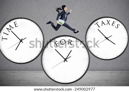 Concept of time for taxes with a businesswoman running on watch
