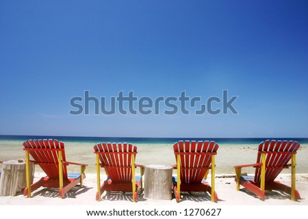 Resort beach chairs at tropical beach
