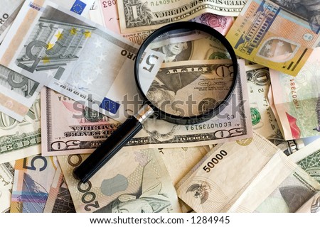 Magnifying glass with US,AUS,Euro,Singapore currency