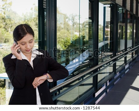 Busy businesswoman making an appointment over the phone