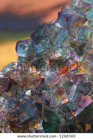 Fluorspar crystal mineral on coloured background