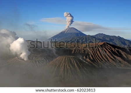 Amazing view of active volcanoes with gas eruption, Mountain Bromo at sunrise, Indonesia.