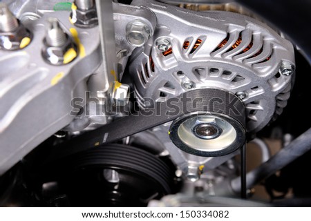 closeup car timing belt in clean engine room