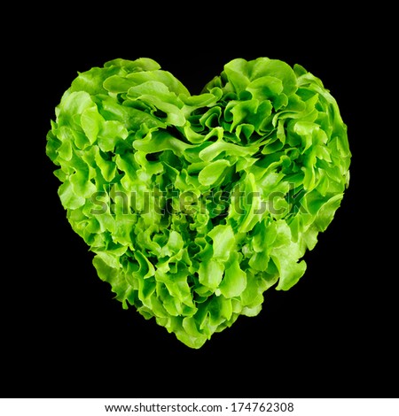 isolate lettuce in heart shape over black background