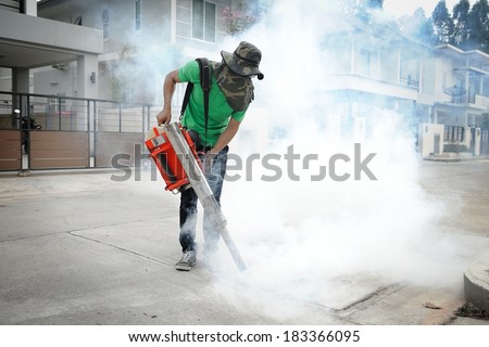 CHONBURI, THAILAND - MARCH 24: Unidentified man fogging chemical to anti mosquitos on March 24, 2014 in Chonburi, Thailand.