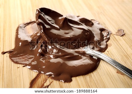 chocolate melted on wooden chopping block