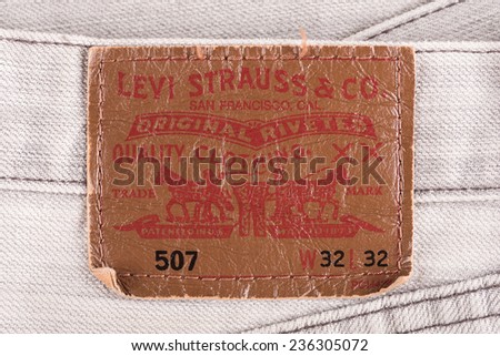 BANGKOK, THAILAND - DECEMBER 09 2014: Close up of the LEVI\'S leather label on the old gray jeans. LEVI\'S is a brand name of Levi Strauss and Co, founded in 1853.