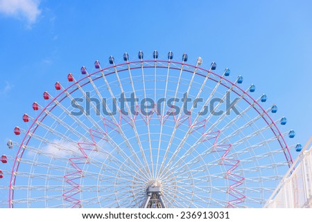OSAKA, JAPAN - NOVEMBER 07, 2014: Tempozan Ferris Wheel against blue sky at Tempozan Harbor Village in Osaka, Japan.