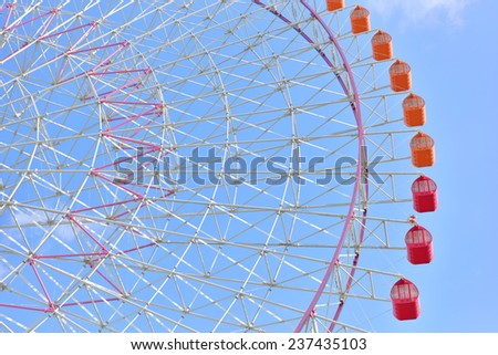 OSAKA, JAPAN - NOVEMBER 07, 2014: Tempozan Ferris Wheel against blue sky at Tempozan Harbor Village in Osaka, Japan.