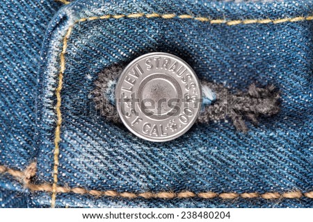 BANGKOK, THAILAND - DECEMBER 09 2014: Close up detail of button of the LEVI\'S denim jeans. LEVI\'S is a brand name of Levi Strauss and Co, founded in 1853.