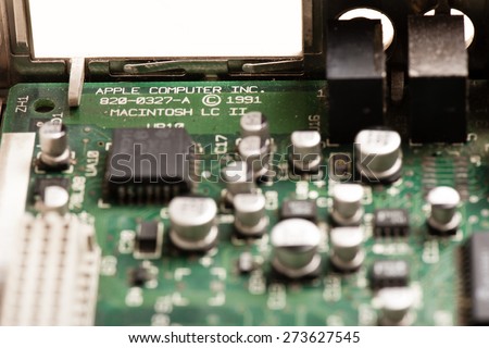 BANGKOK, THAILAND - APRIL 29, 2015: Closeup word APPLE COMPUTER INC. on the old motherboard made by Apple Computer.
