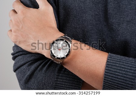 closeup luxury watch on wrist of man