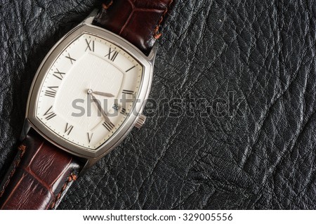 vintage style of luxury men watch with stainless case and leather strap
