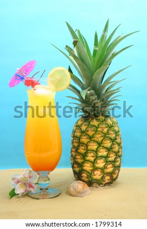 Tropical Drink and Pineapple on Sand