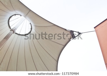 White canvas roof tent  and building