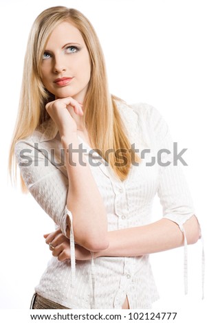 Half length portrait of a beautiful young blond woman pondering.