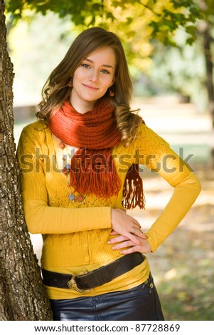 Outdoors portrait of colorful clothed gorgeous fall fashion girl.