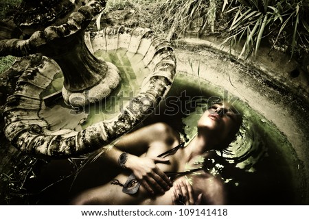 fantasy water nymph enjoy in old abandoned garden fountain photo compilation small amount of grain added